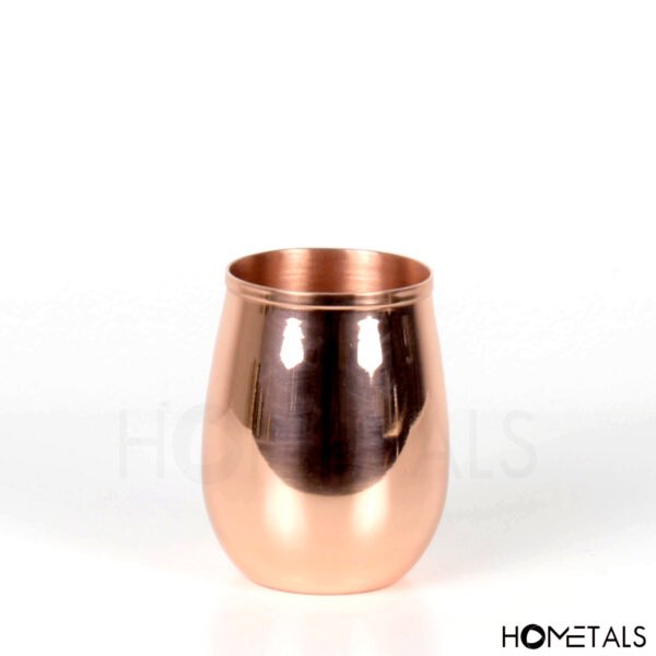 Elegant curved copper tumbler for serving drinks