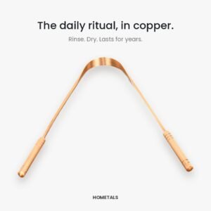 Angled view of a copper tongue cleaner showing the curved scraping edge and both handles