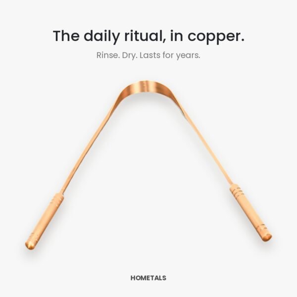 Angled view of a copper tongue cleaner showing the curved scraping edge and both handles